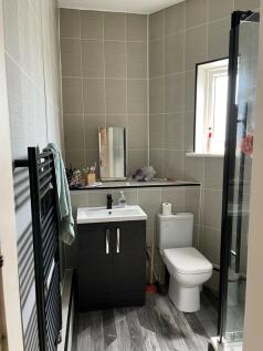 A modern, well-maintained bathroom with a conve...