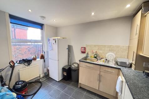 Bright and functional kitchen area with suffici...