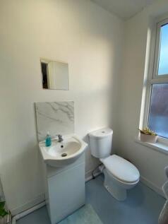 A clean, well-maintained bathroom featuring a t...