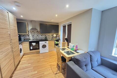 Bright and welcoming living room featuring mode...