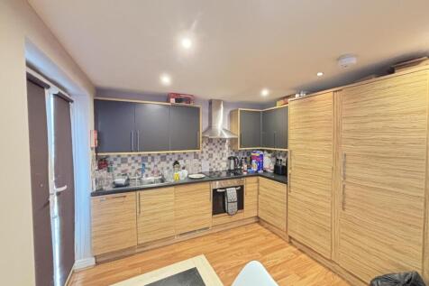 Modern kitchen with ample workspace, integrated...