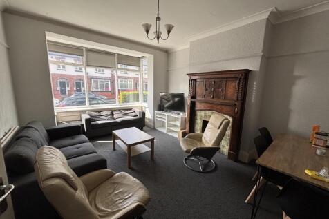 A well-lit, inviting living room featuring a mi...