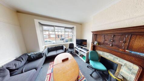 Bright and welcoming living room featuring a la...