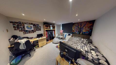 A spacious and modern living room with comforta...