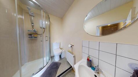 Bright and modern bathroom with a shower, toile...