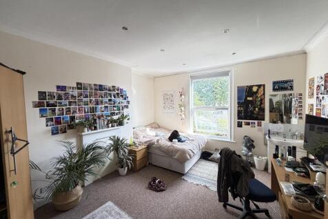 A bright and welcoming living room filled with ...