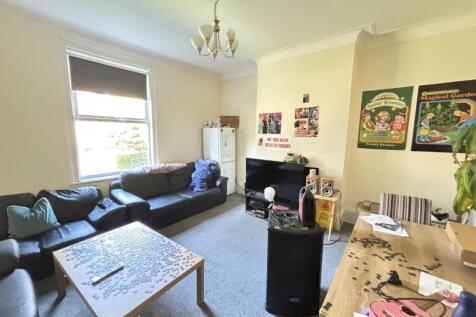 Bright and spacious living room filled with com...