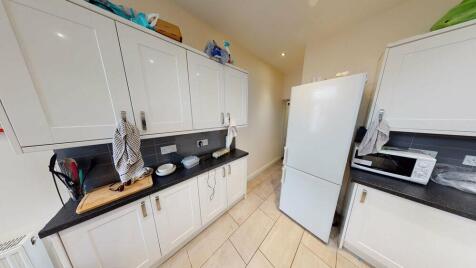 Bright and functional kitchen with ample storag...