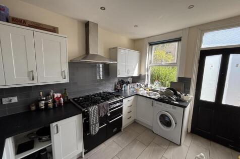 A modern kitchen featuring streamlined cabinetr...