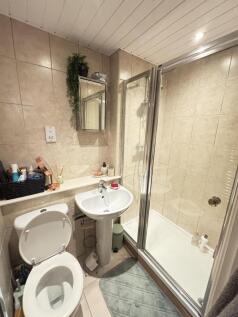 A clean and well-maintained bathroom featuring ...