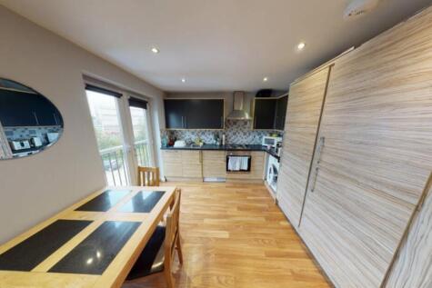 Bright and modern kitchen with ample natural li...