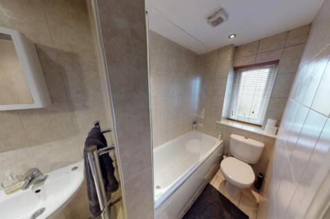 A clean and well-maintained bathroom featuring ...