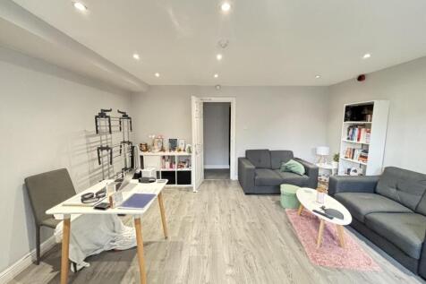 Bright and welcoming living room with modern fu...