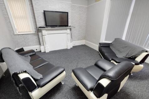 Modern and well-maintained living room with com...