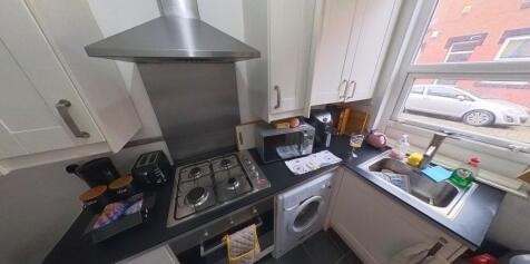 A well-equipped kitchen with modern appliances ...