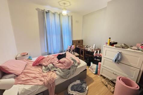 A cozy bedroom with natural light streaming thr...