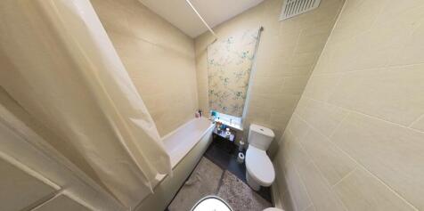 A clean and functional bathroom featuring a sta...