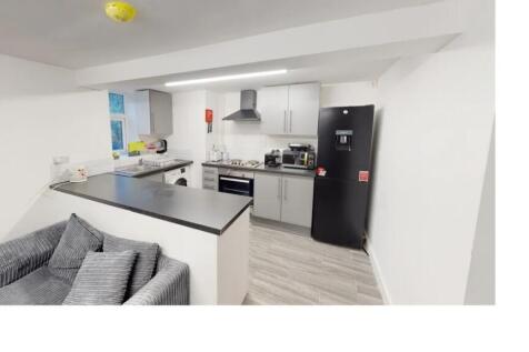 A well-lit, modern kitchen with a clean and min...