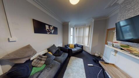 Bright and spacious living room with comfortabl...