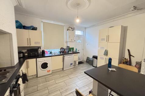 Bright and spacious kitchen featuring modern ap...