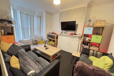 A cozy living room featuring comfortable seatin...