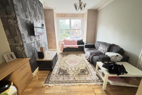 Bright and welcoming living room featuring a co...