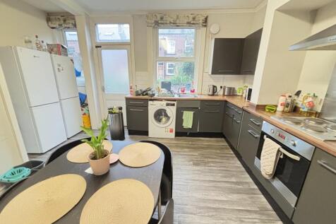 Bright and modern kitchen with ample counter sp...