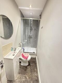 A clean and modern bathroom featuring a spaciou...