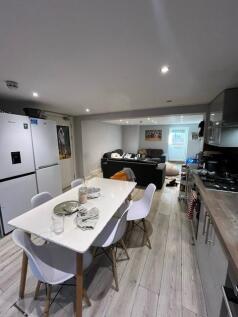 Bright and modern living area featuring a cozy ...