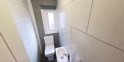 A clean and modern bathroom featuring a large b...