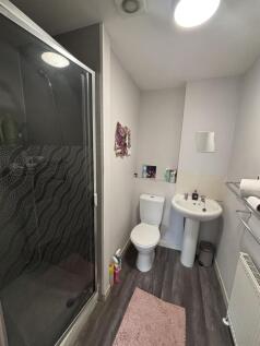 A clean and well-maintained bathroom featuring ...