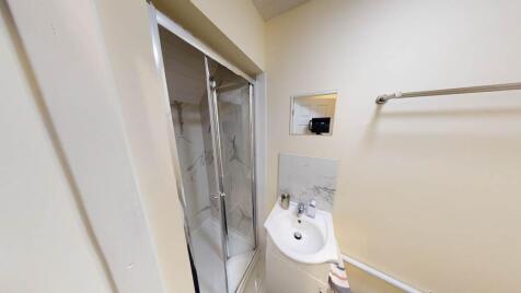 A clean and well-maintained bathroom featuring ...