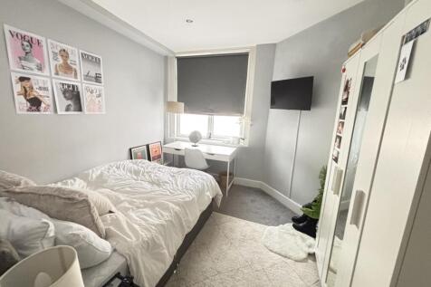 Bright and inviting bedroom featuring a double ...