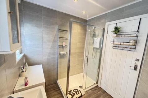 A modern and well-maintained bathroom featuring...