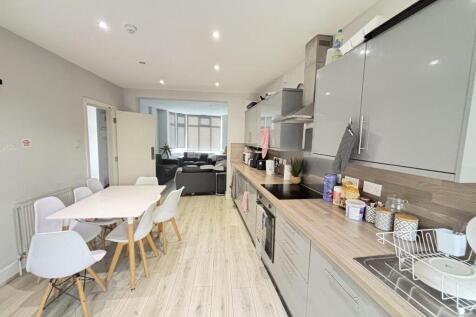 Bright and modern kitchen with ample natural li...