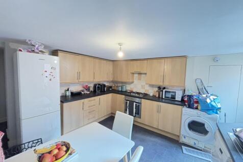 Bright and functional kitchen with ample counte...