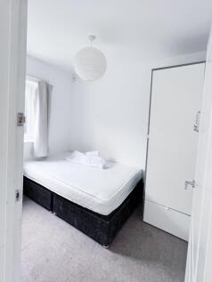 Bright, neatly presented bedroom with a double ...