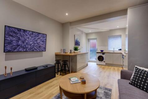 Bright and welcoming living room featuring mode...