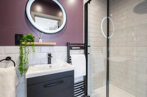 Modern bathroom featuring a sleek sink with a b...