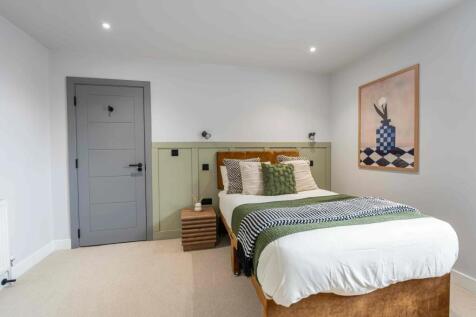 Bright and inviting master bedroom featuring a ...