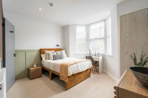 Bright and inviting double bedroom with natural...