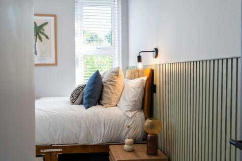 Bright and inviting master bedroom featuring a ...