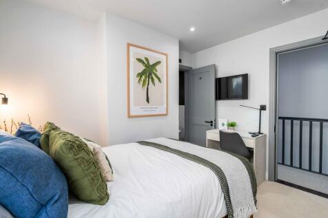 Bright and inviting master bedroom featuring a ...
