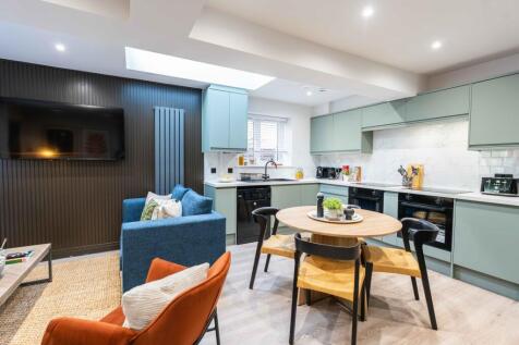 Bright and modern kitchen featuring sleek mint ...