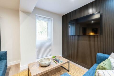 Modern and stylish living area featuring a slee...