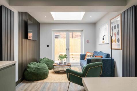 Modern and stylish living room featuring a larg...