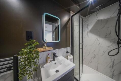 Modern bathroom featuring a sleek sink with a m...
