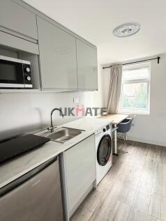 A modern kitchen with minimalist design featuri...