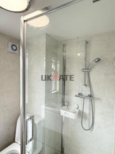 Modern and clean bathroom with a large shower a...