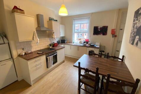 Bright and functional kitchen with ample natura...